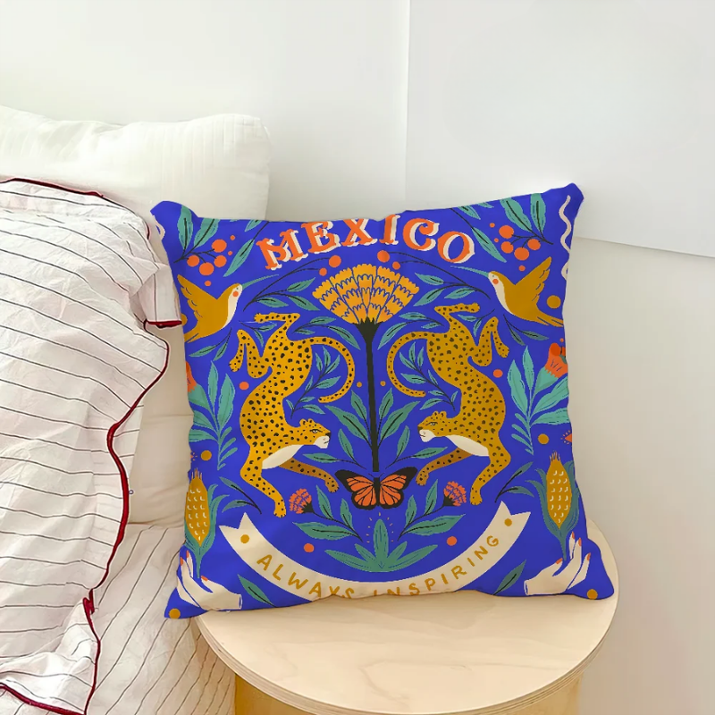 Decorative pillow with 'Mexico Always Inspiring' text on a white couch.