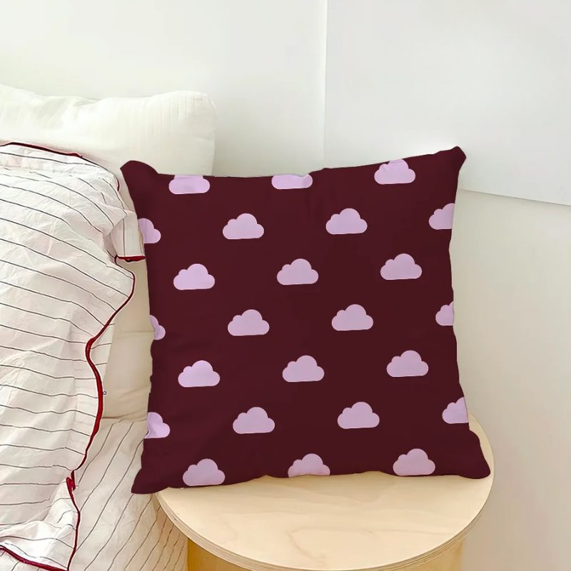 Decorative pillow with cloud pattern on a white couch