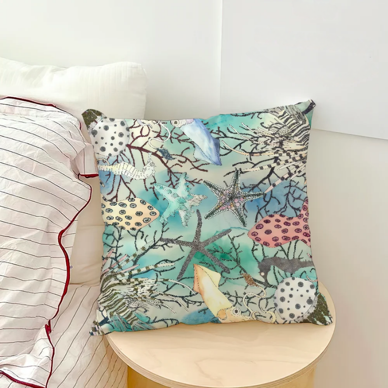Starfish and coral pillow cover with tropical ocean-inspired design on chair