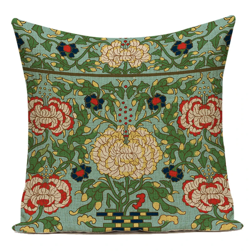 Decorative pillow with floral pattern on a white background.