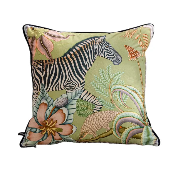 Decorative pillow with a zebra and floral design on a green background