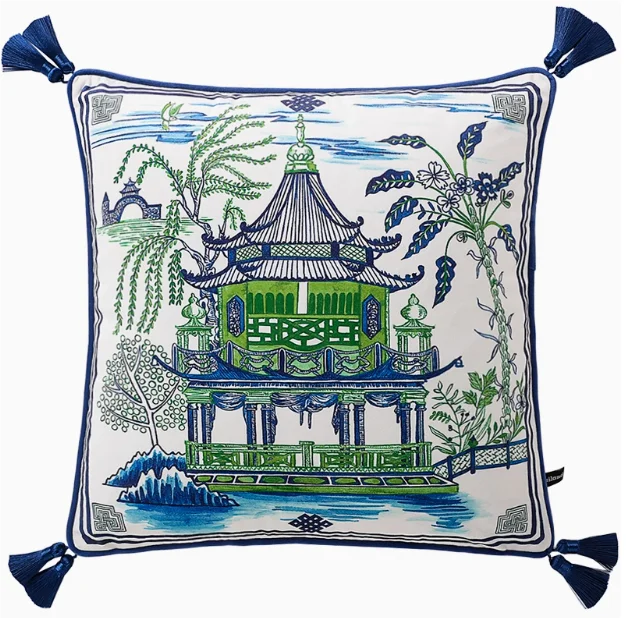 Decorative pillow with Chinese pagoda design on a white background