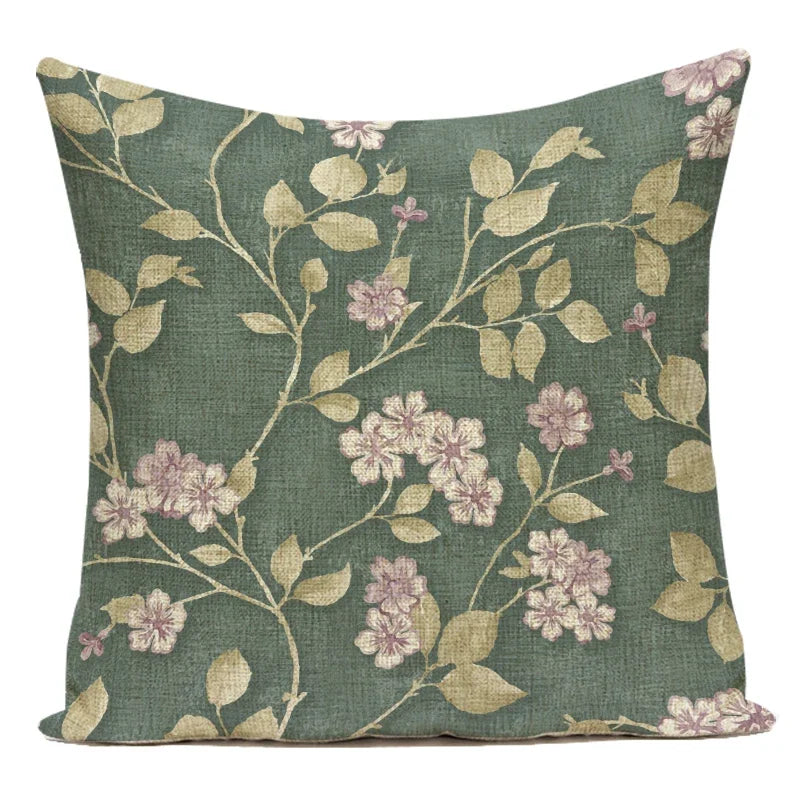 Floral patterned pillow with green background