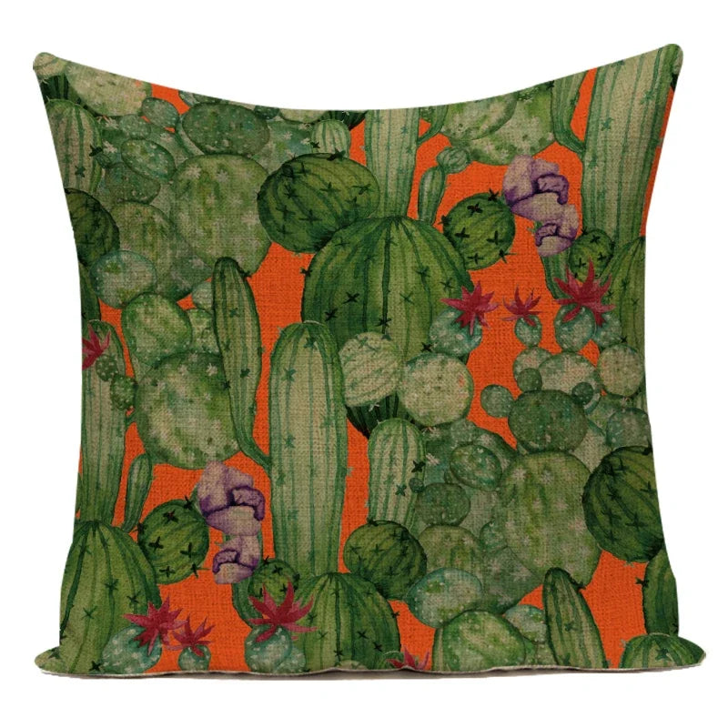 Pillow with cactus and succulent pattern on an orange background