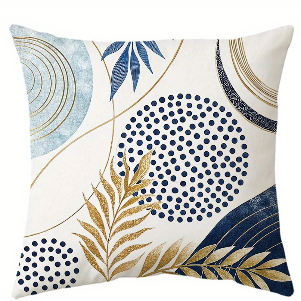 Blue decorative pillow cover with gold leaf botanical pattern on soft fabric