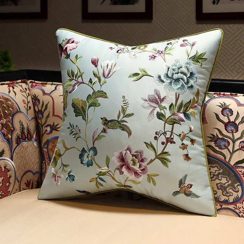 Decorative pillow with floral embroidery on a couch