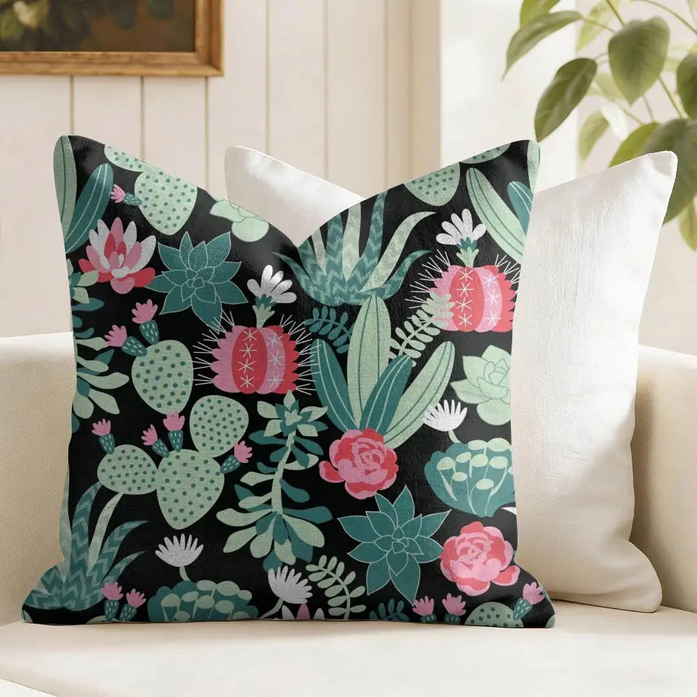 Decorative pillow with cactus and succulent pattern on a couch