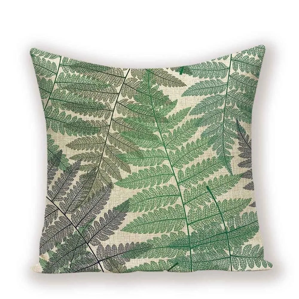 Pillow with green leaf pattern on a beige background