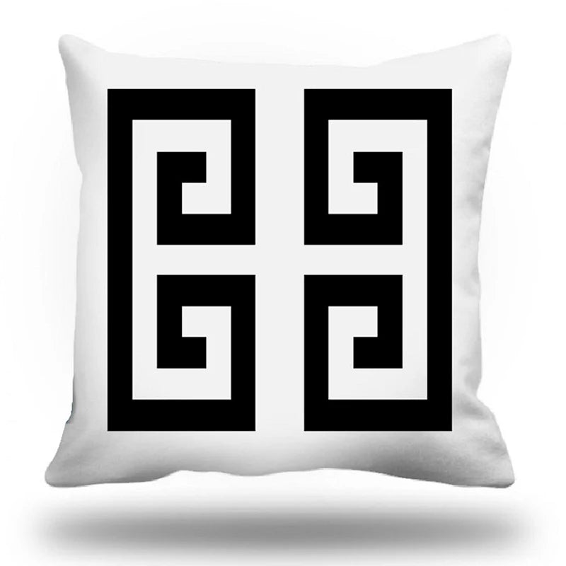 White pillow with black and white geometric pattern