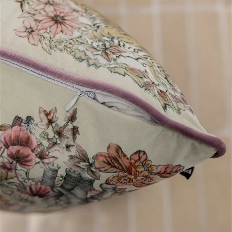 Floral-patterned pillow with a zipper on a neutral background