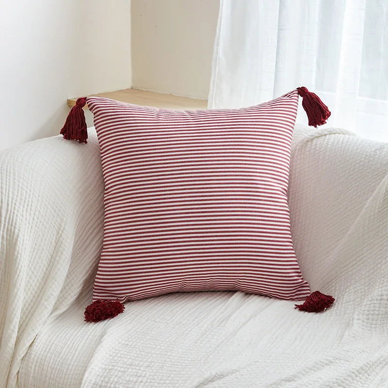 Red striped tassel pillow cover with farmhouse pattern and decorative fringe detail