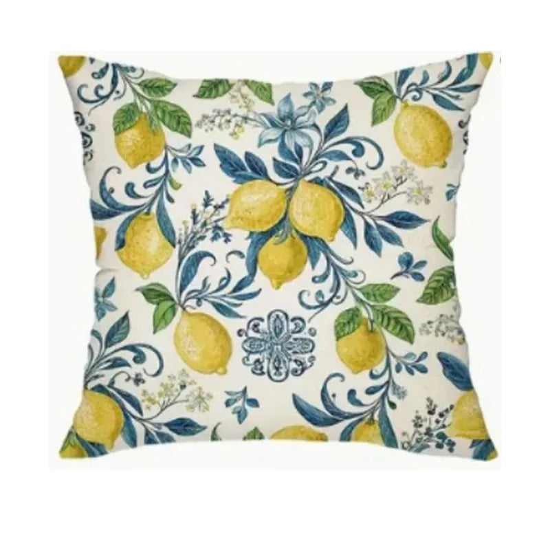 Decorative pillow with lemon and floral pattern on a white background