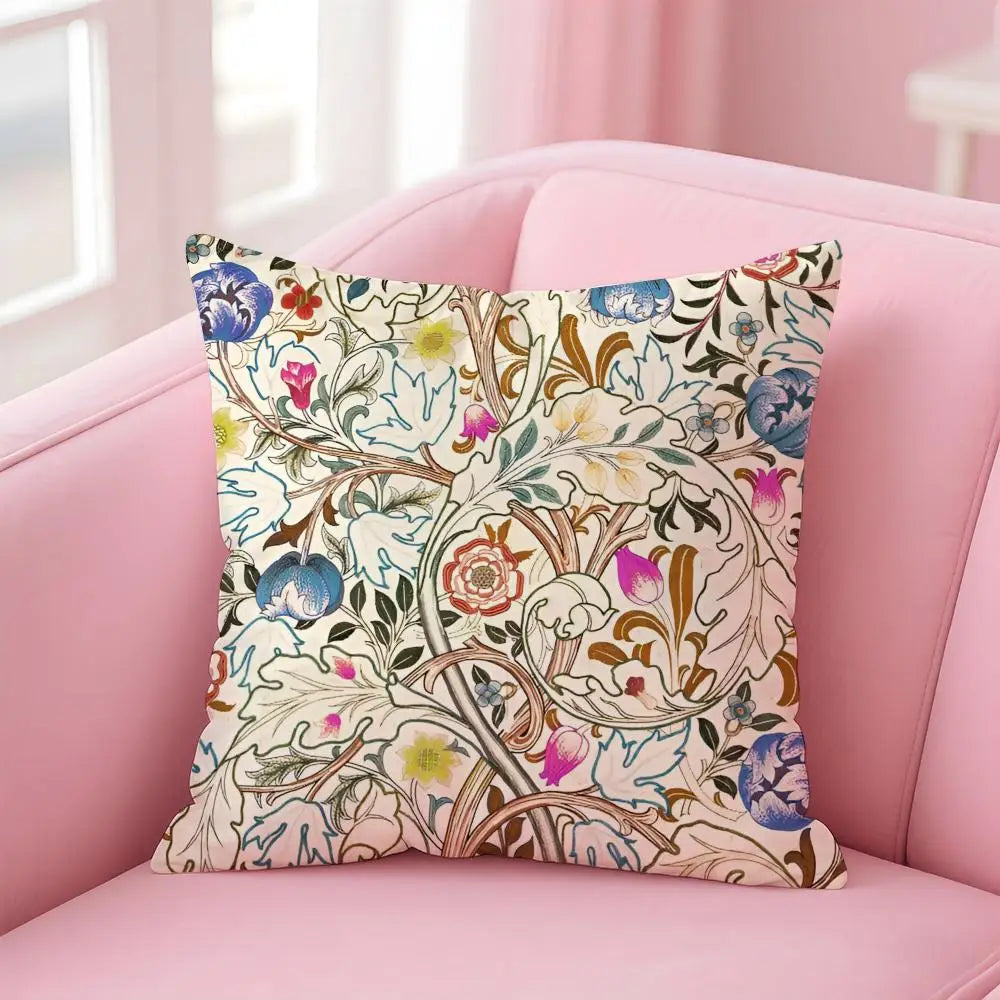 Decorative pillow with floral pattern on a pink couch