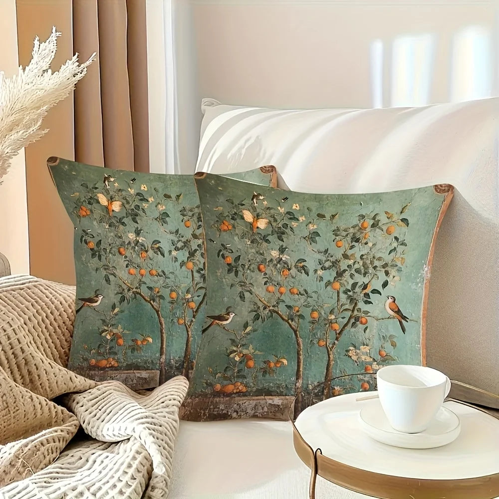 Decorative pillows with nature-themed design on a couch