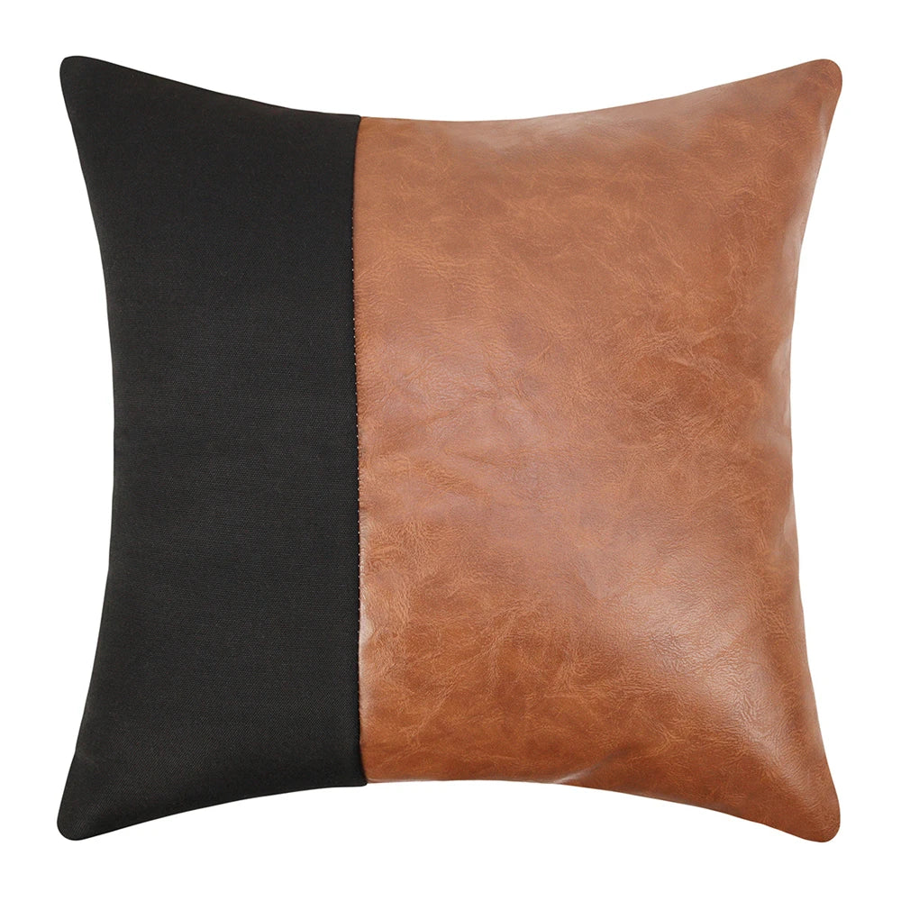 Two-toned black and brown leather pillow on a white background