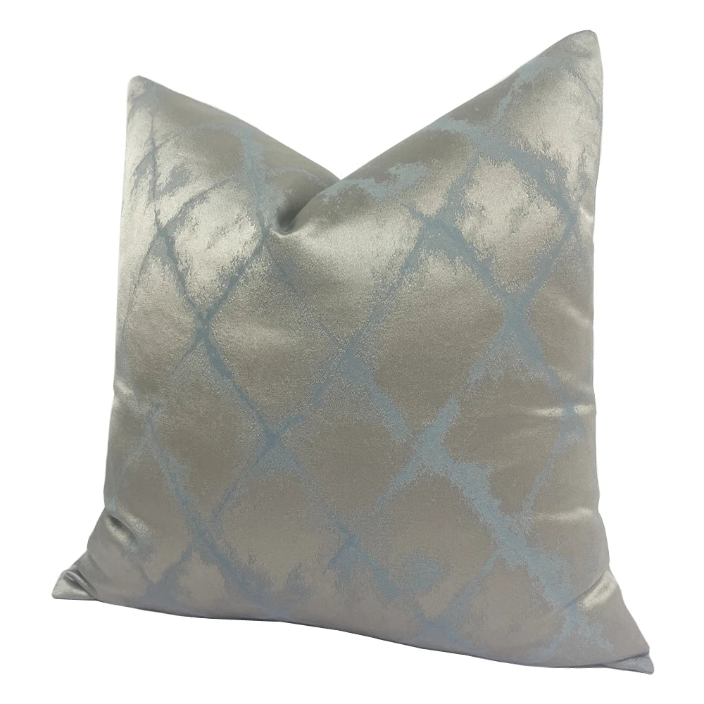 Decorative pillow with blue abstract pattern on a white background