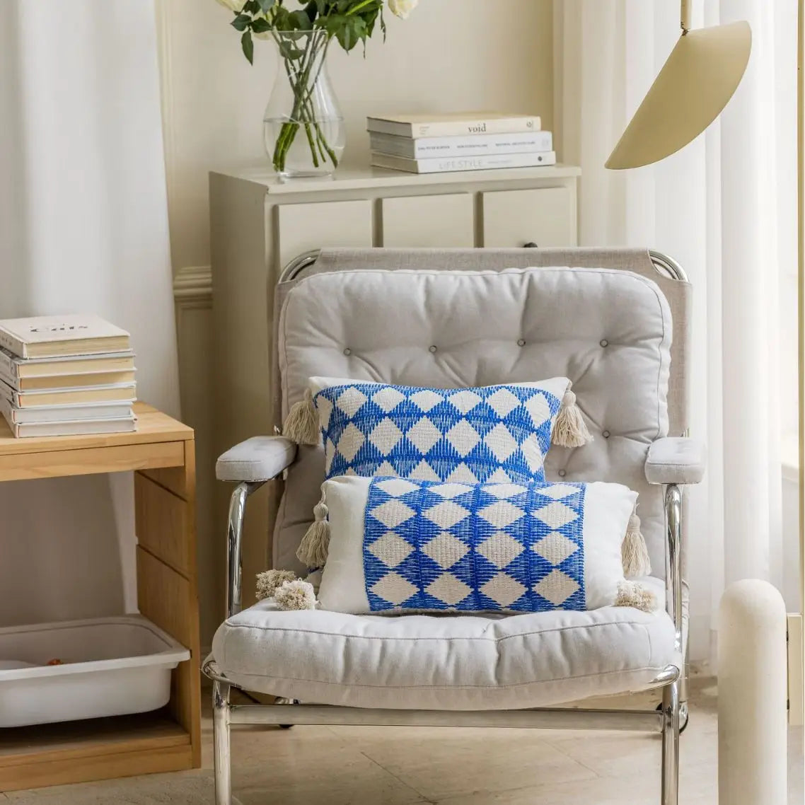 Blue geometric jacquard cushion cover on modern armchair
