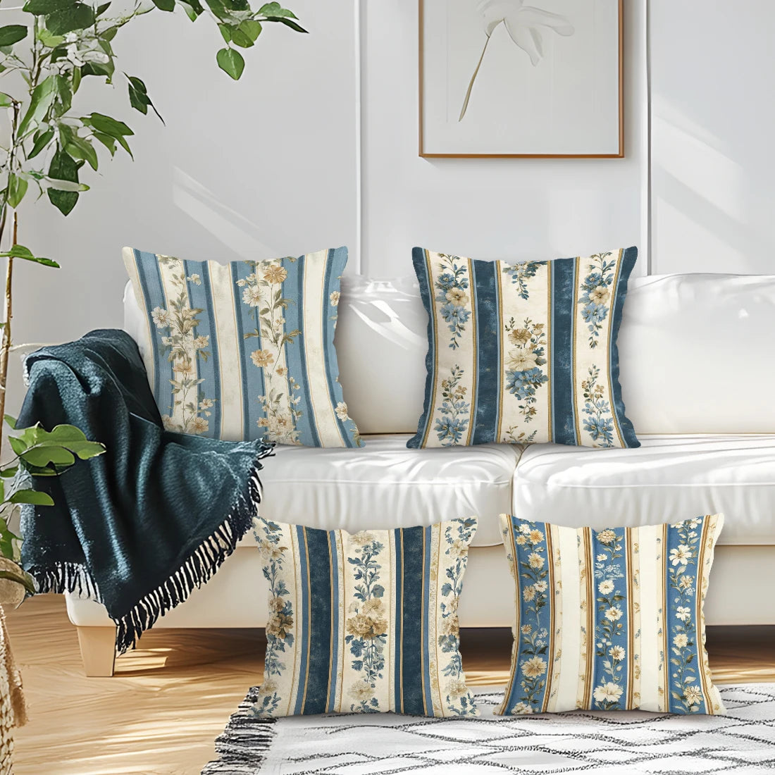 Decorative pillows with floral patterns on a white sofa in a living room setting.