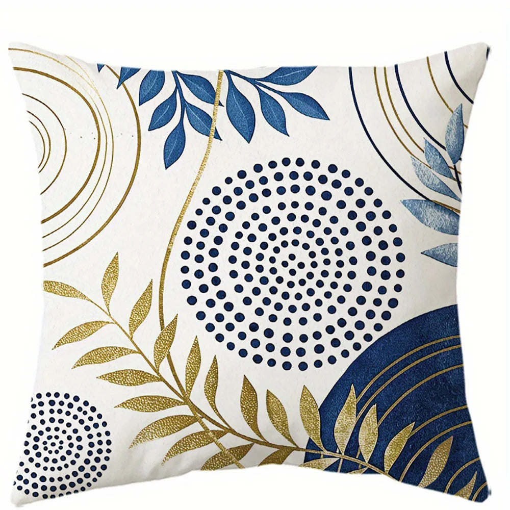 Blue decorative pillow cover with gold leaf botanical pattern on soft fabric