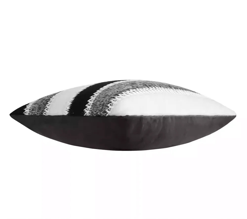 Decorative pillow with black and white pattern on a white background, featuring the brand 'Ruiyi Textile'.