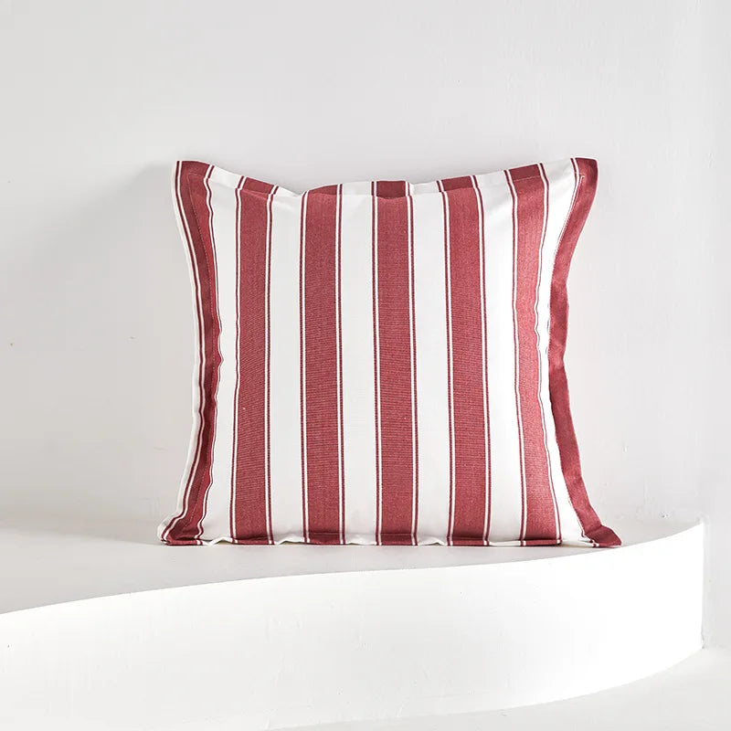 Red striped tassel pillow cover with farmhouse pattern and decorative fringe detail