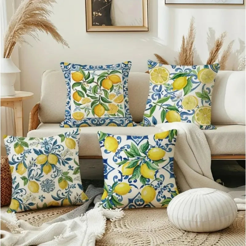 Decorative pillows with lemon pattern on a couch in a living room setting