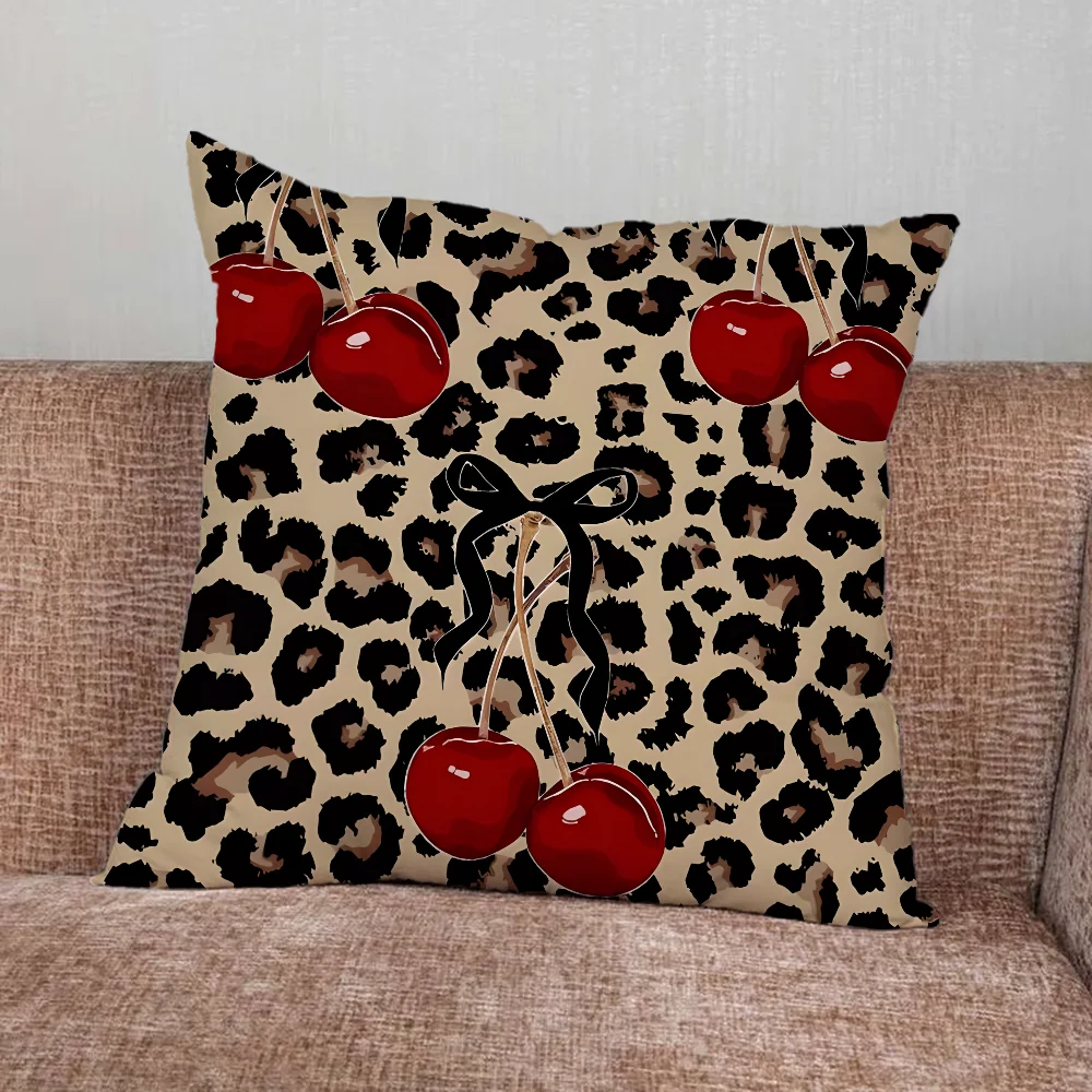 Leopard print pillow cover with cherry and star graphics in playful modern design