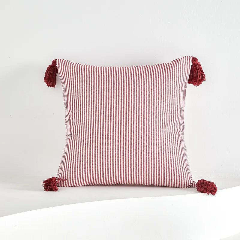 Red striped tassel pillow cover with farmhouse pattern and decorative fringe detail