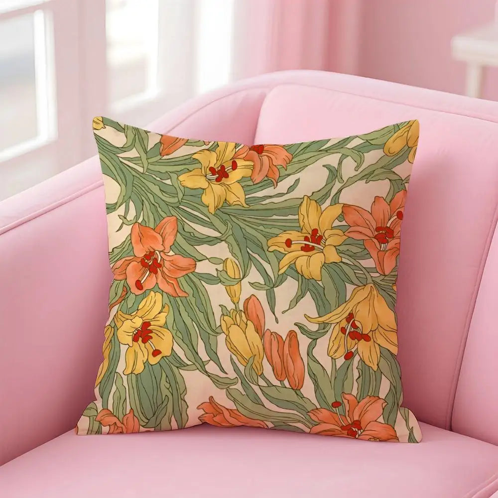 Floral-patterned pillow on a pink couch with a light background