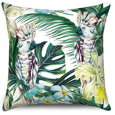 Decorative pillow with parrot and tropical leaf design