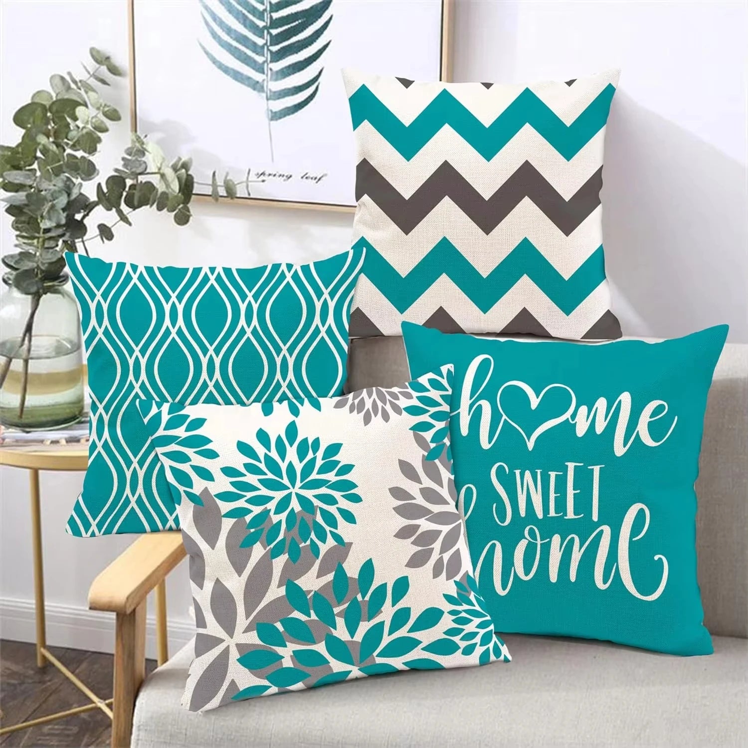 Set of decorative pillows with various patterns on a sofa.
