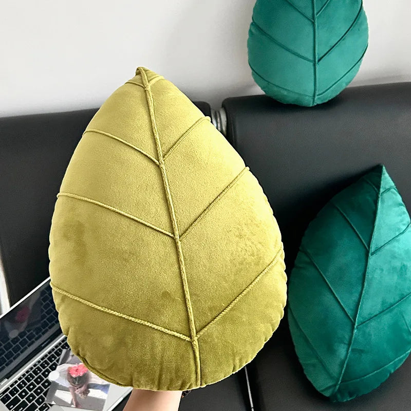 Leaf-shaped yellow and green cushions on a car seat.