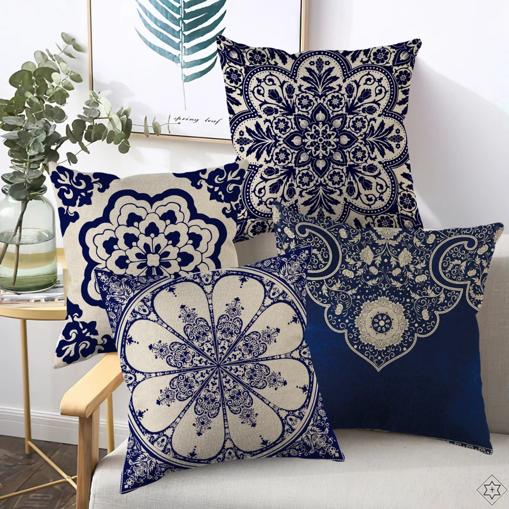 Decorative pillows with blue and white patterns on a sofa