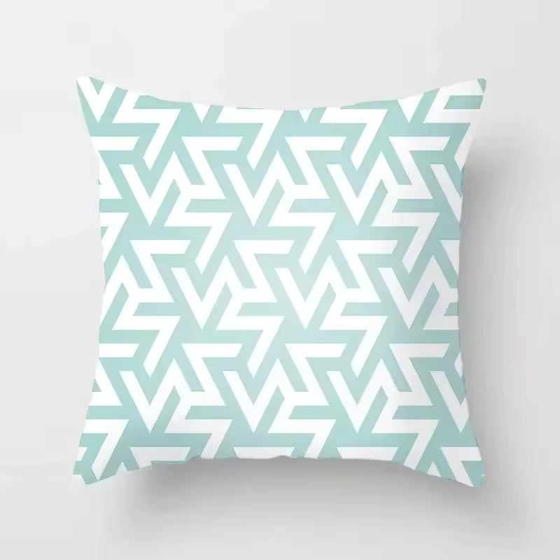 Decorative pillow with a geometric pattern on a light gray background