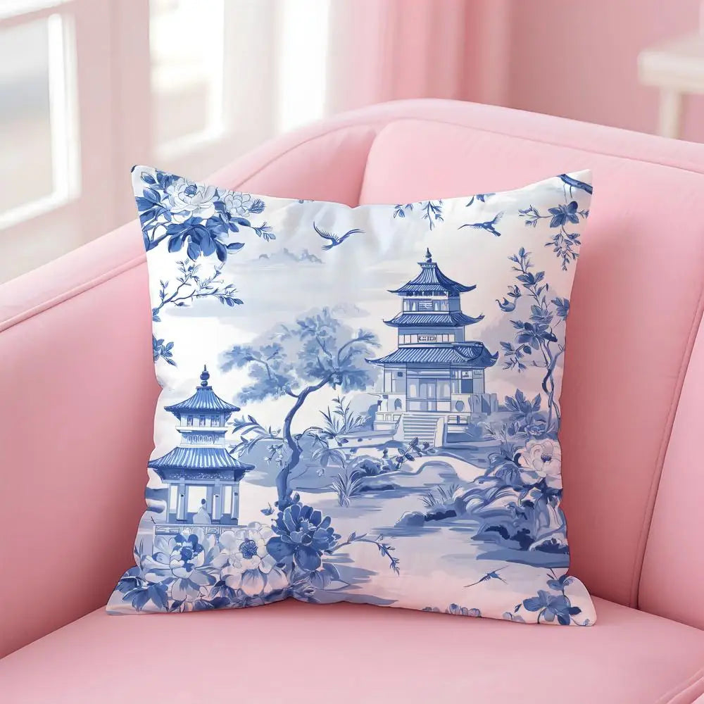 Decorative pillow with blue and white design on a pink couch