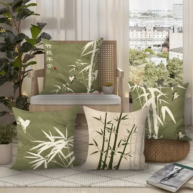 Decorative pillows with bamboo design on a chair in a room with plants and cityscape view.