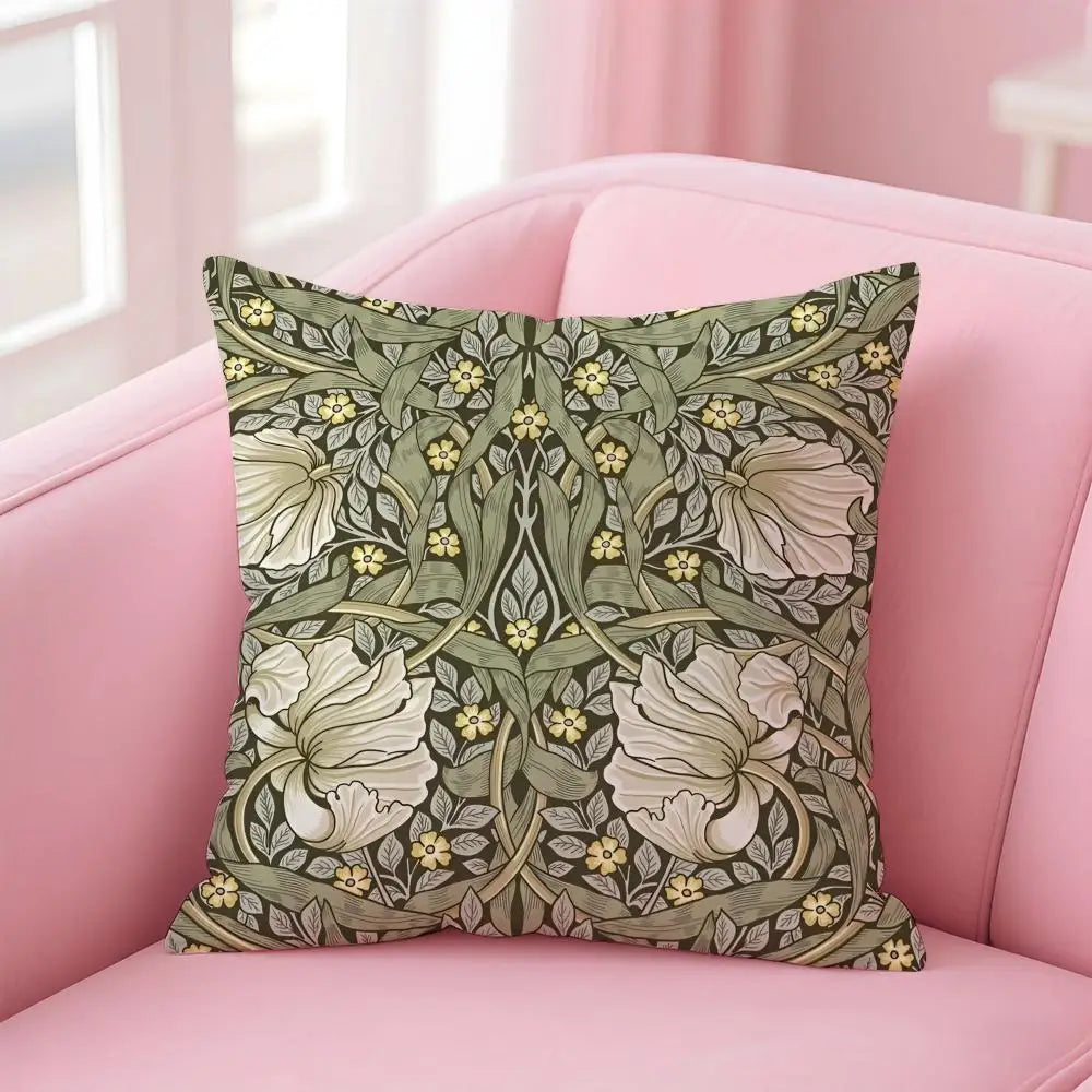 Decorative pillow with floral pattern on a pink sofa