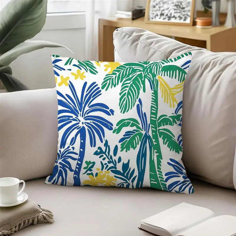 Decorative pillow with palm tree pattern on a sofa