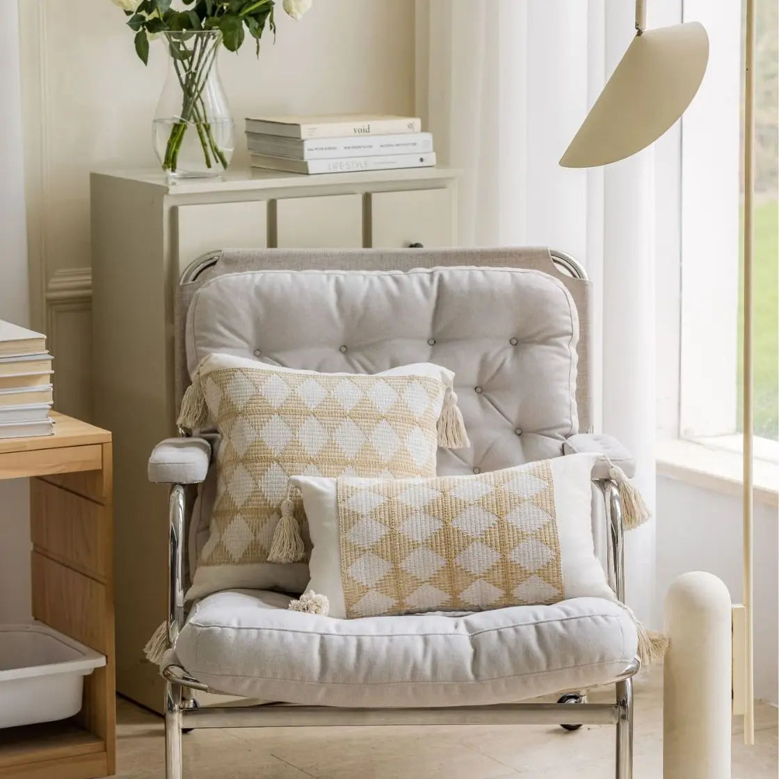 Beige geometric jacquard pillow cover with minimalist pattern on chair