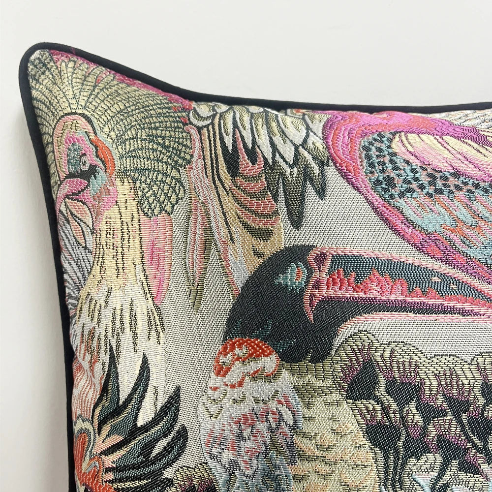 Decorative pillow with bird pattern on a plain background