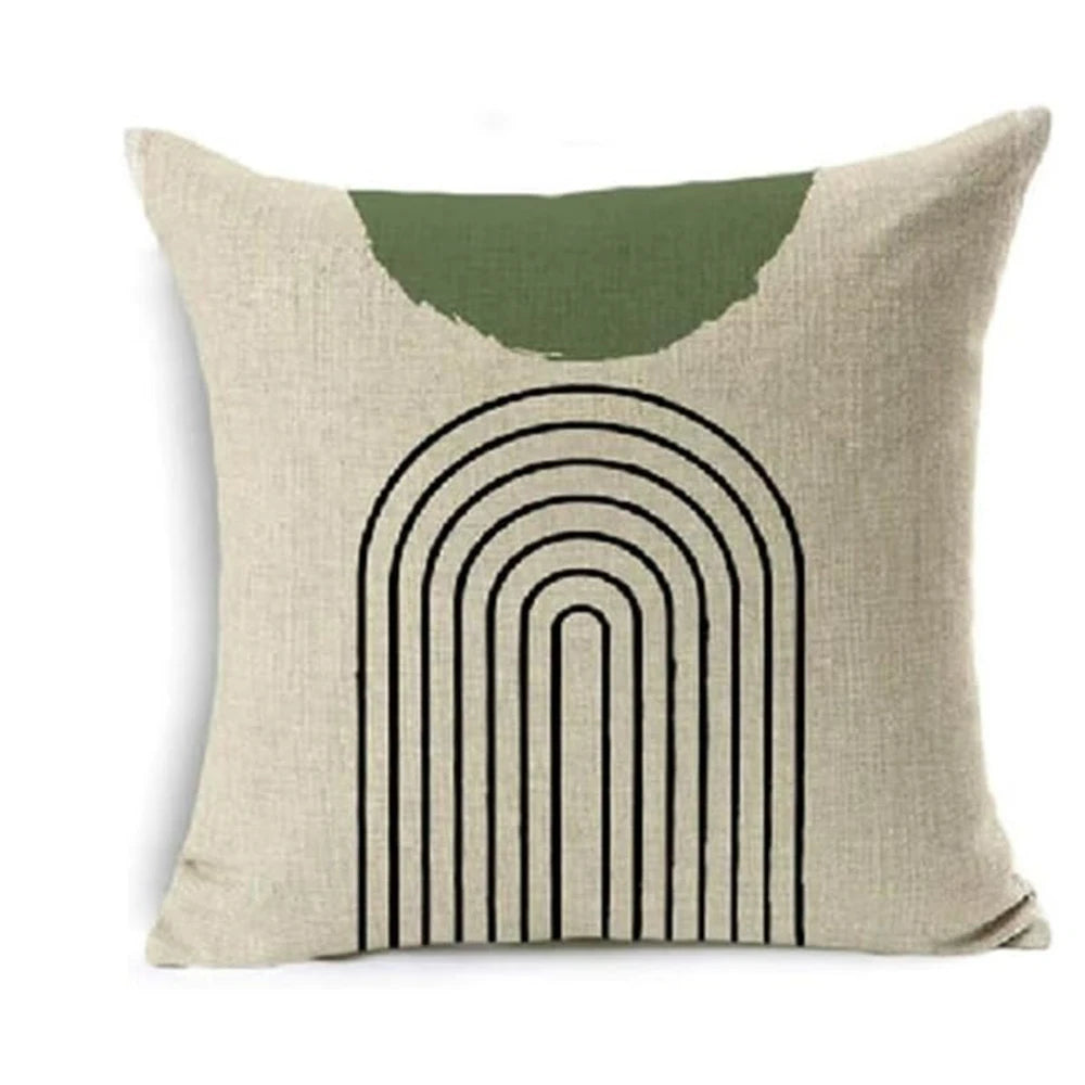 Decorative pillow with green arch and black lines on a beige background