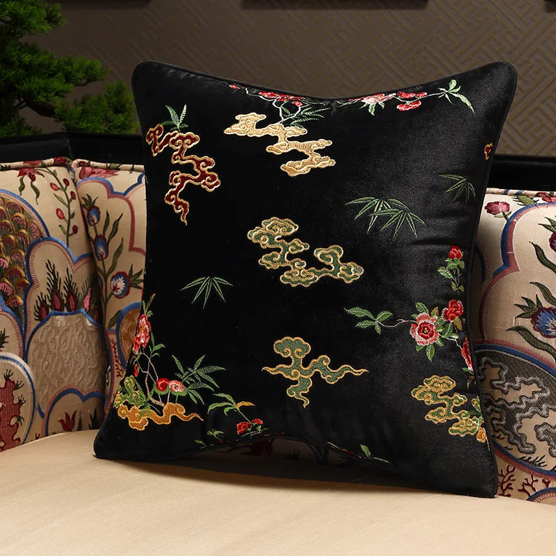 Decorative pillow with intricate embroidery on a couch