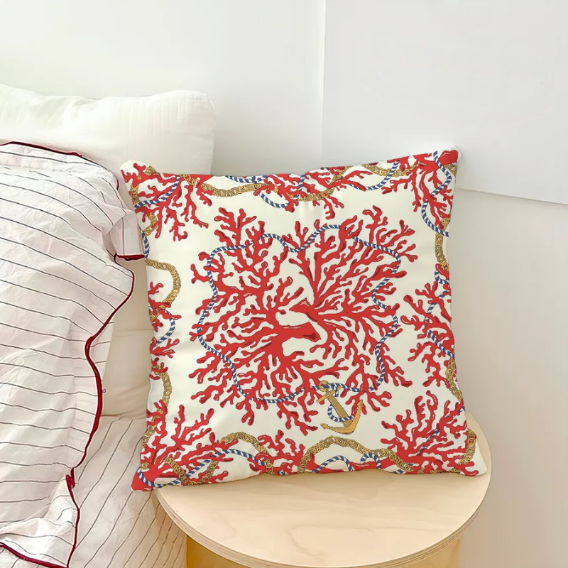 Starfish and coral pillow cover with tropical ocean-inspired design on chair