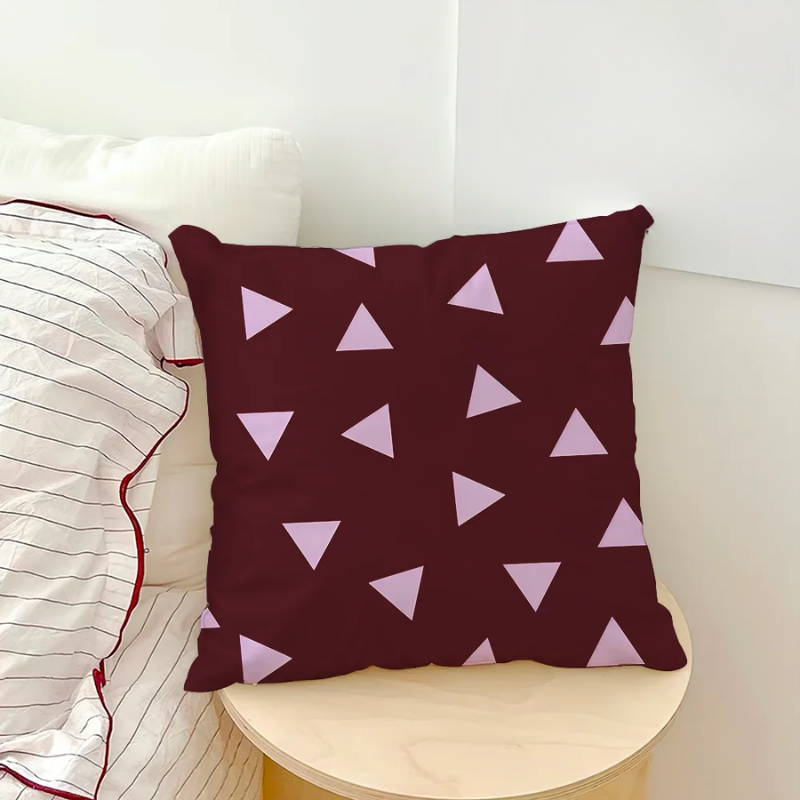 Maroon pillow with pink triangle pattern