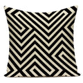Decorative pillow with black and white geometric pattern on a white background