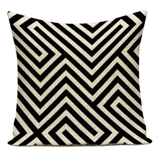 Decorative pillow with black and white geometric pattern on a white background