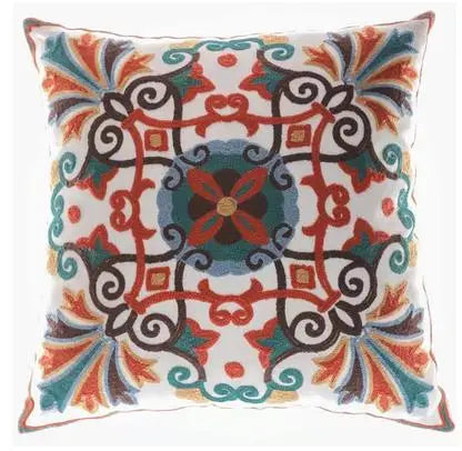 Decorative pillow with a colorful geometric pattern on a white background