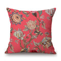 Decorative pillow with floral and bird pattern on a red background