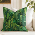 Green cactus patterned pillow on a white couch