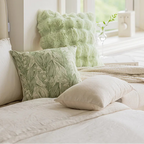 Decorative pillows on a bed with a visible 'Bunny FiFi' brand name.